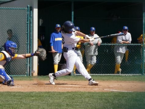 Andy Vega hitting a ball pitched by the LA Harbor Seahawks on March 17. 