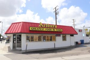 A view of Arthurs restaurant from the outside, which the sign says, Greatest food in town.