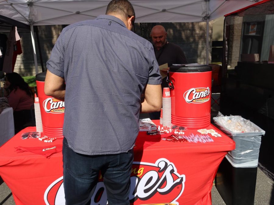 The Canes booth handing out free lemonade and giving away one item per visitor, visitors can pick to take a wristband or bandana for their pet, March 18. 