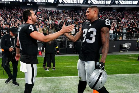 LAS VEGAS, NEVADA - DECEMBER 18: Derek Carr #4 of the Las Vegas Raiders and Darren Waller #83 celebrates after a game against the New England Patriots at Allegiant Stadium on December 18, 2022 in Las Vegas, Nevada. 