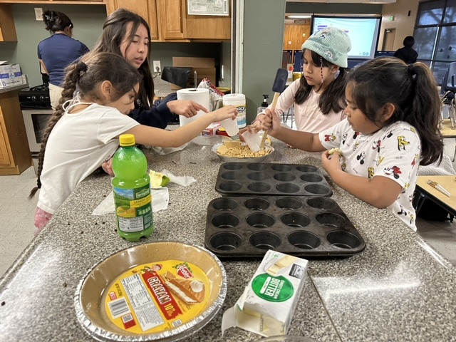 The girls were getting the crumbs ready to add as a topper for their pies.