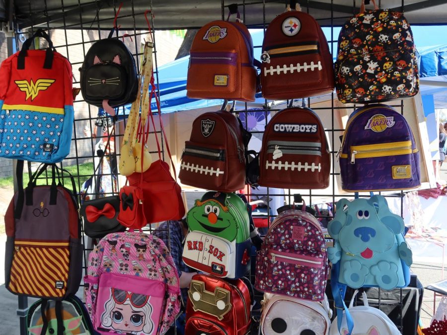 The most popular item sold by Manuel Sifuente at the Downey Street Fair consisted of mini loungefly backpacks, March 18. 