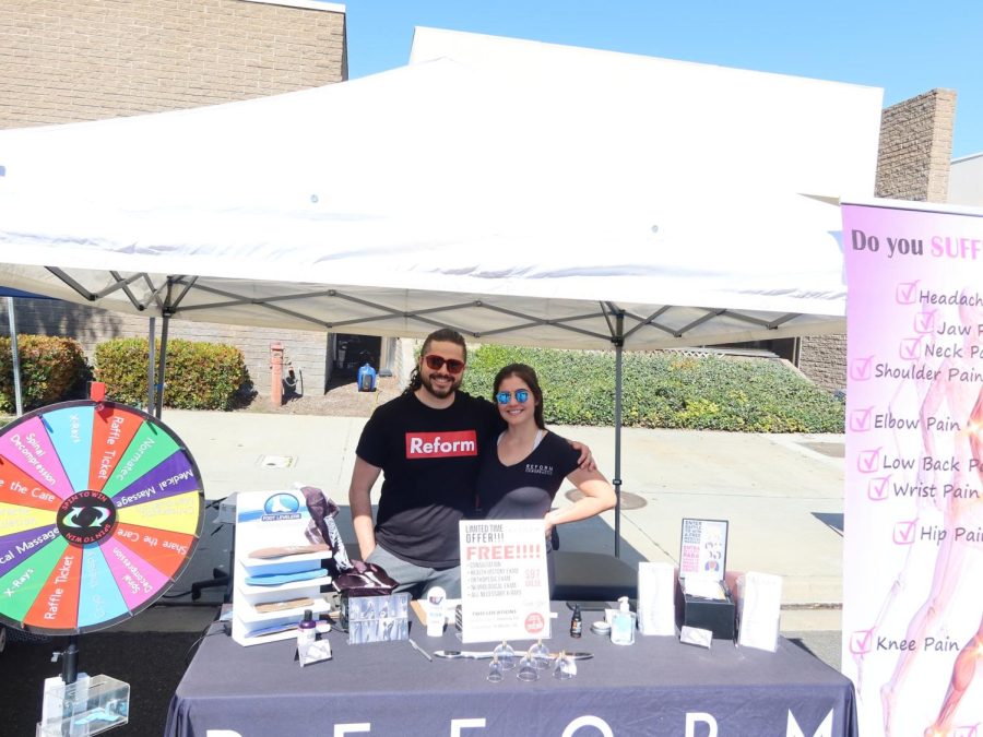 Daniel Sophomore and his co-worker representing Reform Chiropractic at the Downey Street Fair, March 18. 
