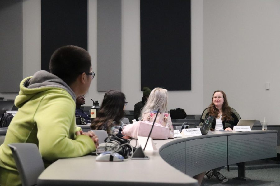 Senator Bartholomew, the person farthest away from the photo, talks while all the ASCC senators give her eye contact and pay attention to everything she brought up during Mar. 8's ASCC meeting. 