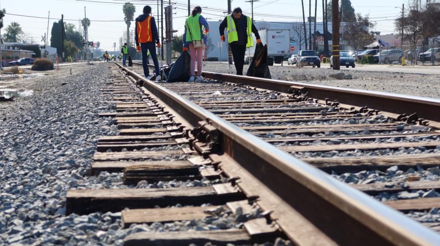 Volunteers of the Keep Downey Beautiful Clean Up are cleaning up the train tracks on March 18. 