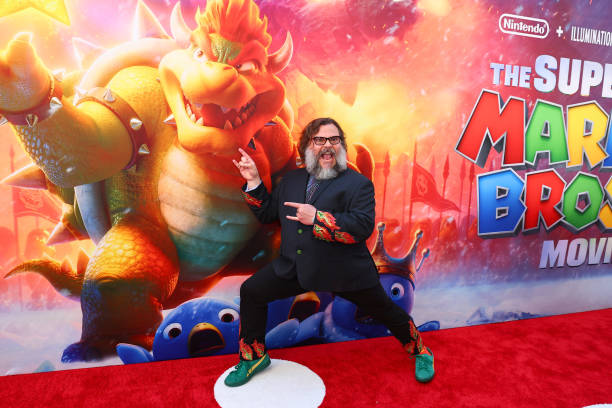 Jack Black posing in front of his character Bowser Photo credit: Getty Images &  Kayla Oaddams