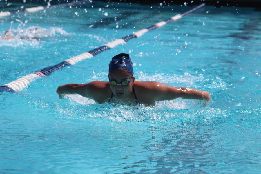 Heres one of the Falcons swimmers and shes focused on getting first place for her team on March 31.