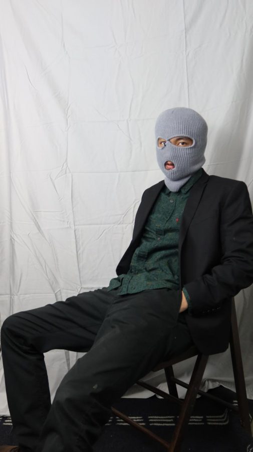 Cream Boi, donning a ski-mask and posing for photos at his residence on March 30, for WINGS magazine. 