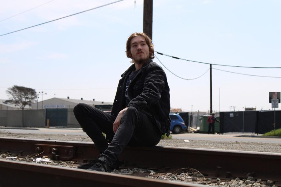 Adam Marx stares at the sky and sits right near the train tracks near Downey on March 17. 