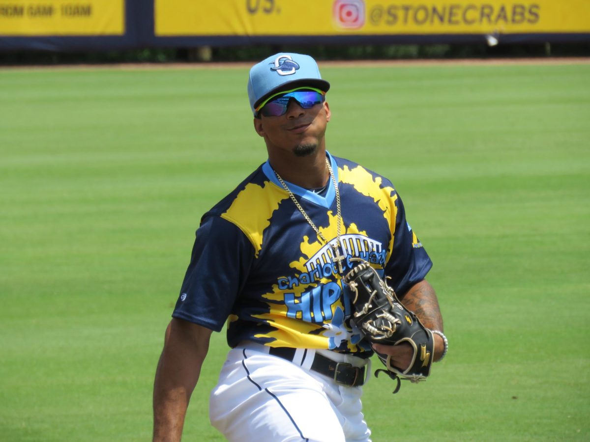 Wander Franco smiling at the camera before playing a game with the Charlotte Stone Crabs.