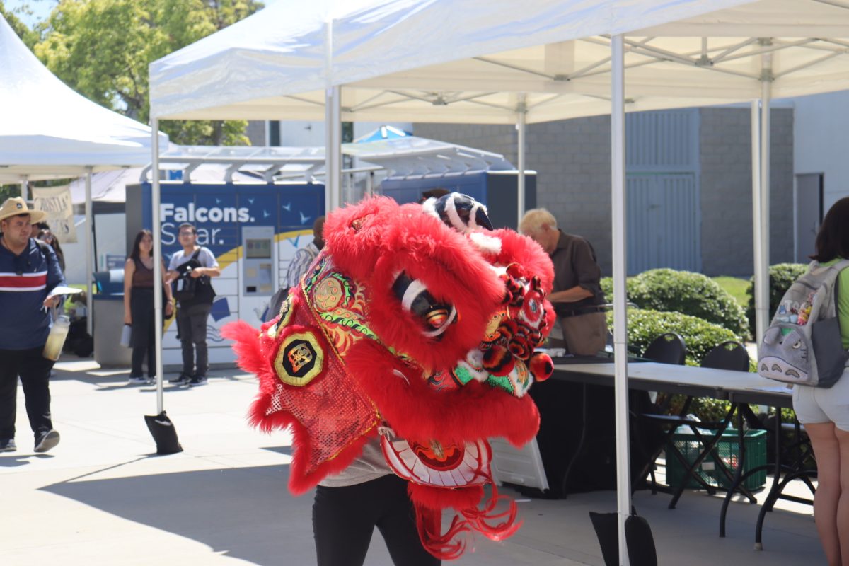 Chinese dragon head moving around along the library sidewalk.