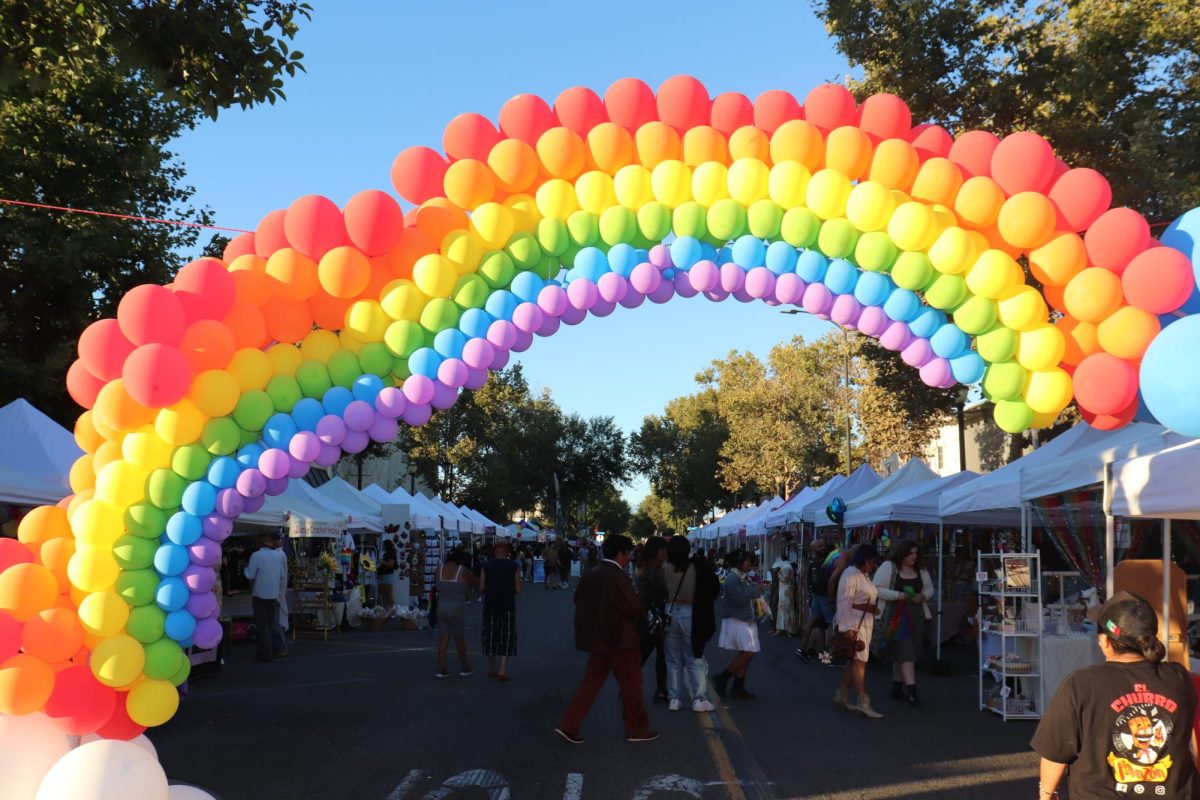 Somewhere over the balloon-made rainbow, festival goers strolled Downey Ave. as they supported local vendors and nonprofits.