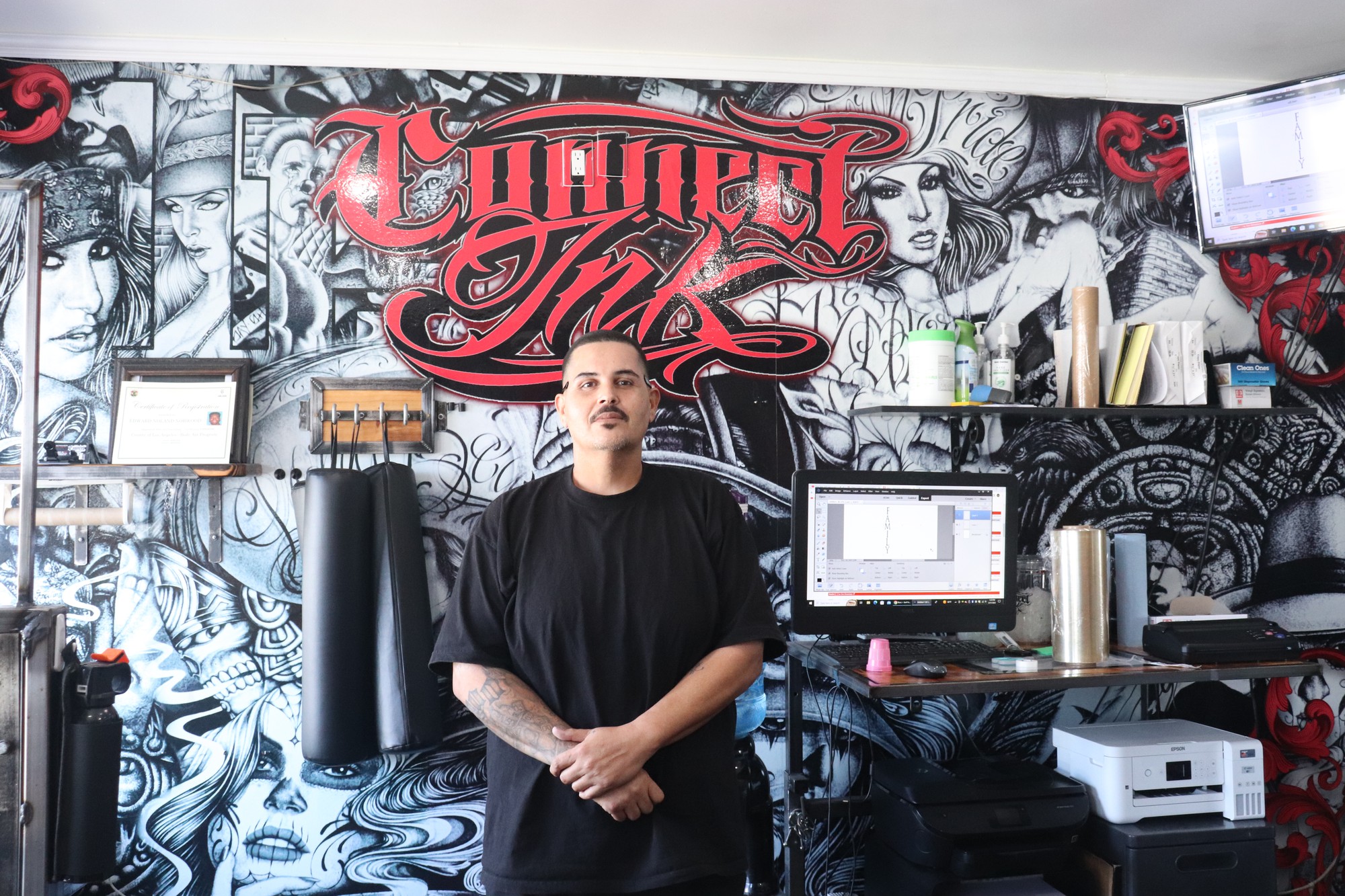 Simon Vasquez Jr. stands proudly in the shop he created.