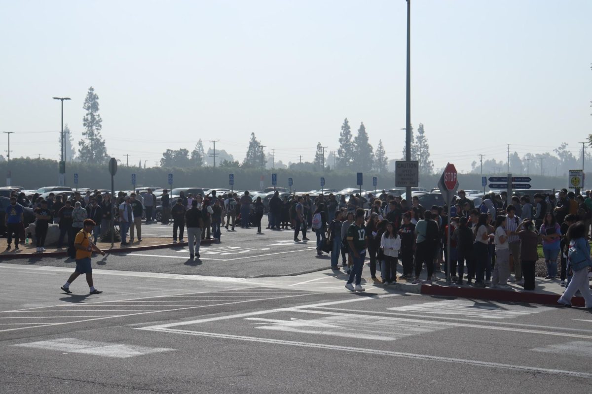 Students gathered in parking lot 10 after evacuating the buildings. 