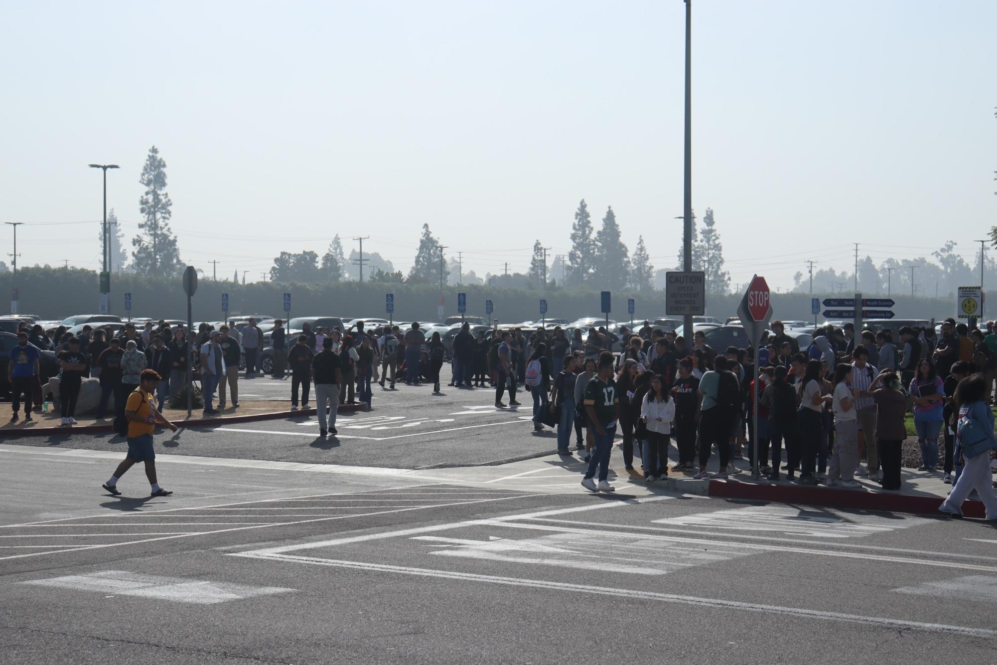 Students gathered in parking lot 10 after evacuating the buildings. 