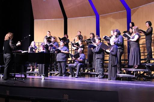 The choir singing on stage. 