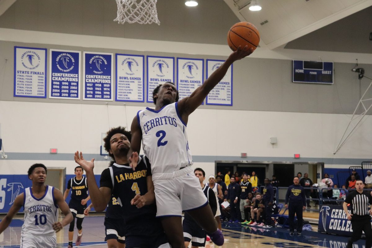 Dillon Botts lay up attempt while being defended by Timothy Lofton 