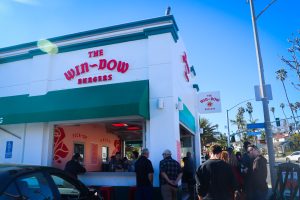 Front entrance to The Win-Dow in Long Beach with a lot of people waiting in line to order. 