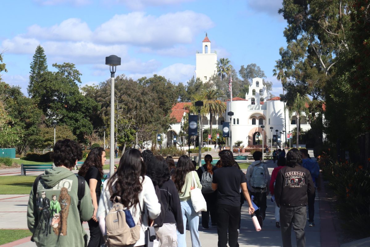 Group of Cerritos College students walking towards Hepner Hall.