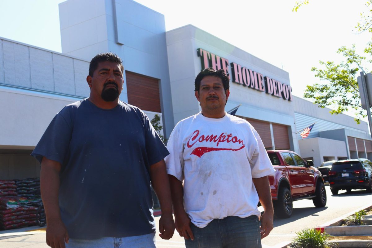 Jose and Raul, day laborers waiting for work, April 10. Photo credit: Edward Fernandez