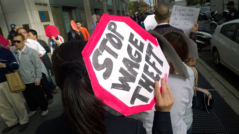 Protestors marching at a wage theft rally in front of the New York State Department of Labor on Oct. 15 2014. 