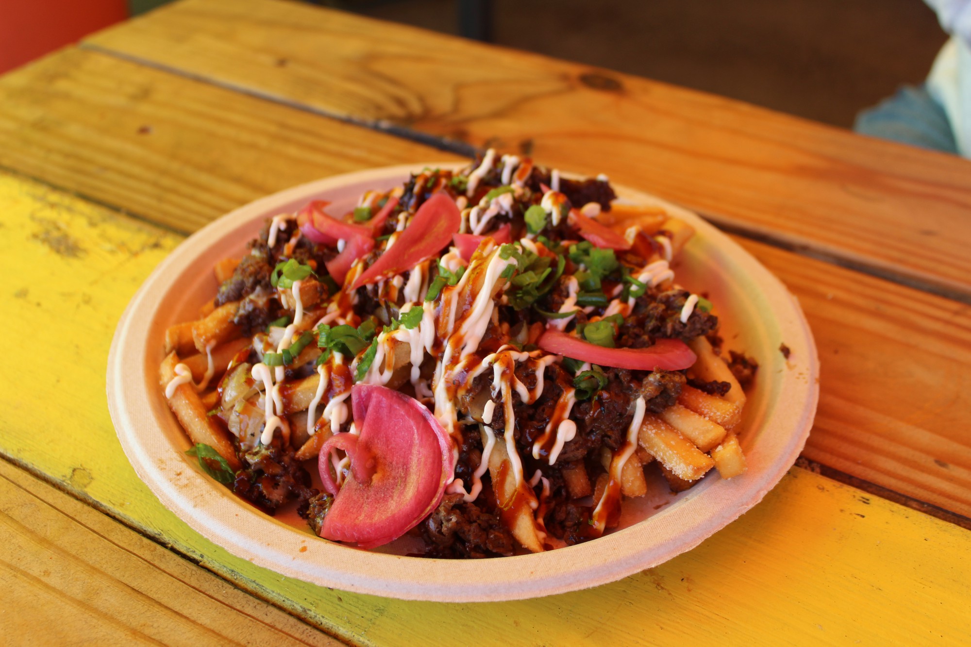 Delicious bulgogi fries with pickled red onions