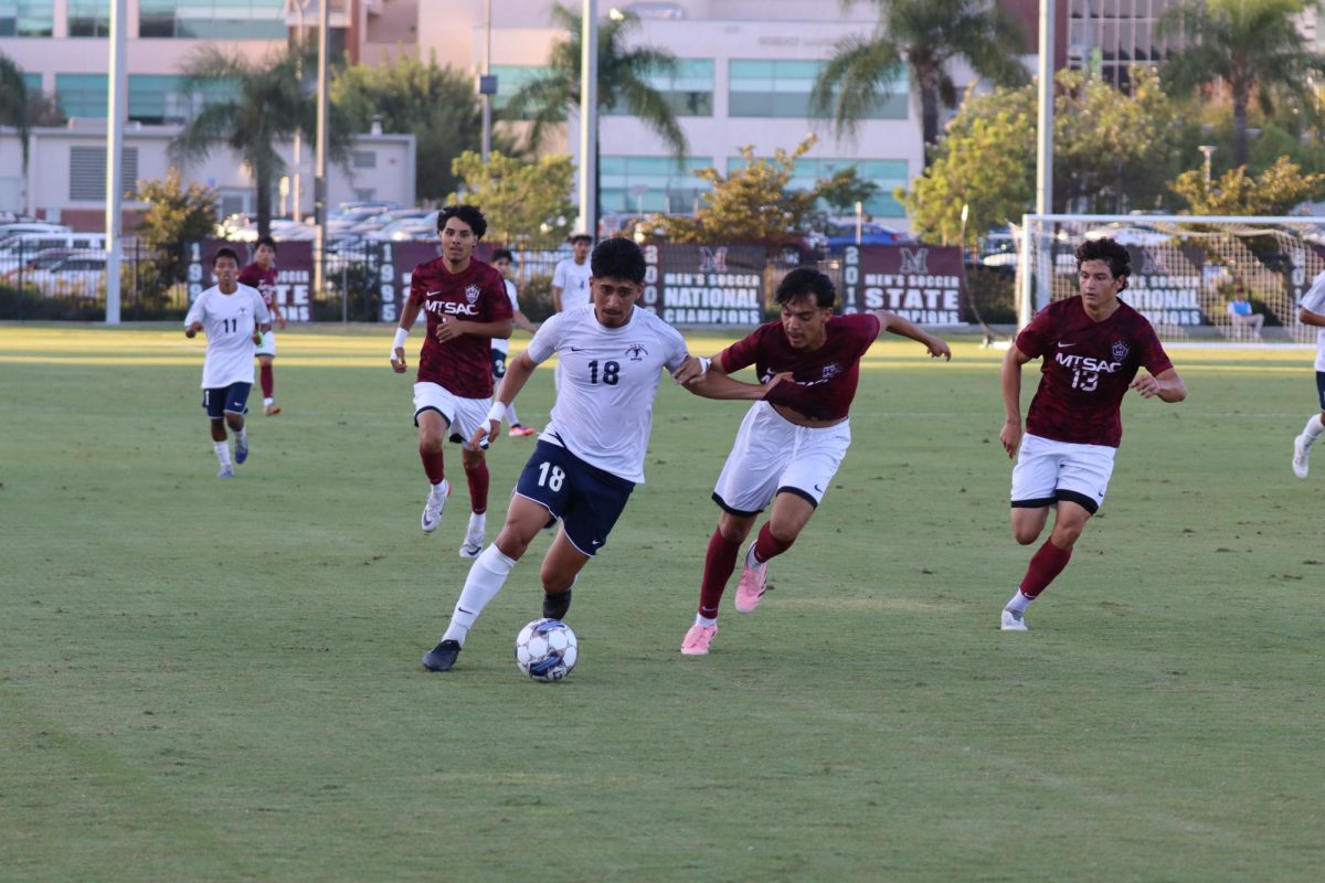 Falcon forward Christian Ramirez holding back Mt. SAC midfielder Joseph Prado at Mt San Antonio College Soccer Fields in Walnut on Oct. 7, 2025.