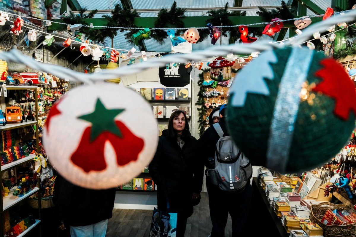 People visit a Christmas store in a holiday market at Bryant Park in New York City, U.S., November 16, 2025. REUTERS/Eduardo Munoz