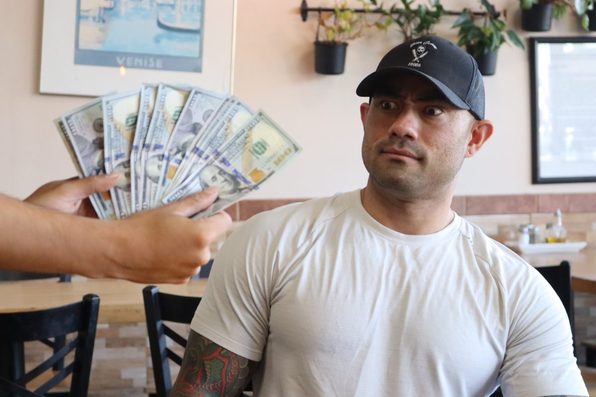 Nathan Figueroa being shown $1,000 dollars before the challenge. Oct. 11, 2025 Photo credit: Duran Ventura