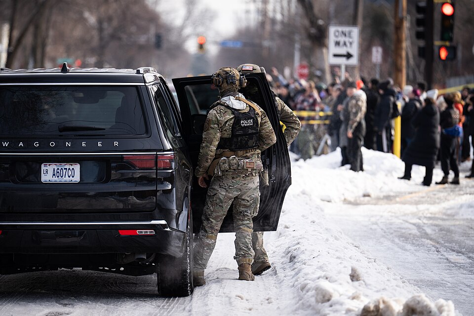 Portland Avenue and 34th Street in South Minneapolis, showing
ICE agents after the shooting.