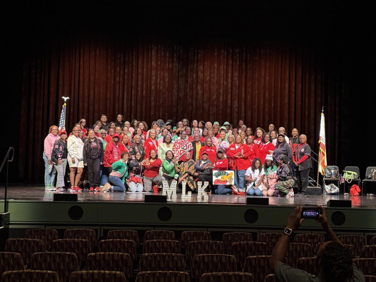 Alpha Kappa Alpha Sorority, Inc., and Delta Sigma Theta Sorority, Inc. united after the celebration of Martin Luther King. The two groups shows unity of African Americans coming together as one.