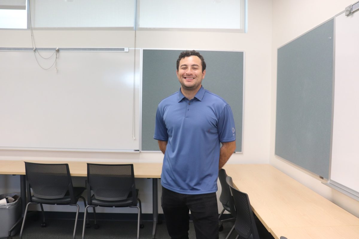 Eric Calderon, in the automotives building, after giving a presentation for the Cerritos Scholarship Foundation. 