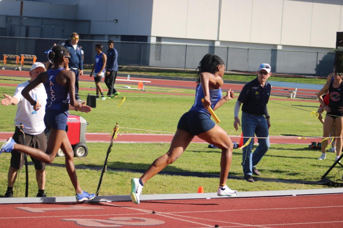 Jayla Barnwell and Deona Standifer with the final 4x400 hand-off Costa Mesa, California Friday, Jan. 30, 2026.